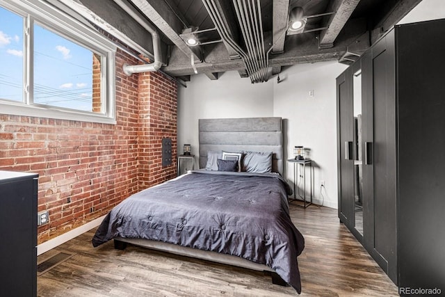 201 Lamkin St Unit 204, Pueblo, CO 81003 - bedroom with brick wall and wood finished floors