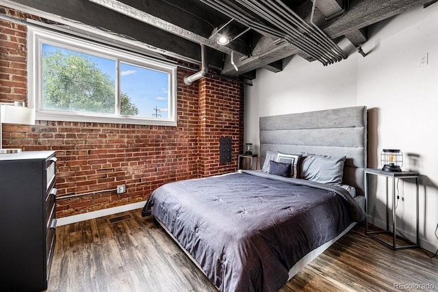 201 Lamkin St Unit 204, Pueblo, CO 81003 - bedroom featuring brick wall and wood finished floors
