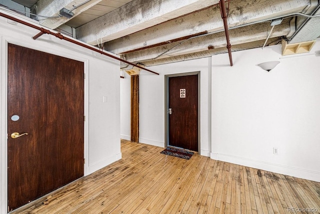 201 Lamkin St Unit 204, Pueblo, CO 81003 - below grade area featuring light wood finished floors and baseboards