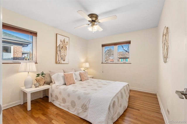 bedroom featuring ceiling fan and light hardwood / wood-style floors