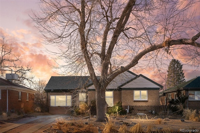 view of front of house with brick siding