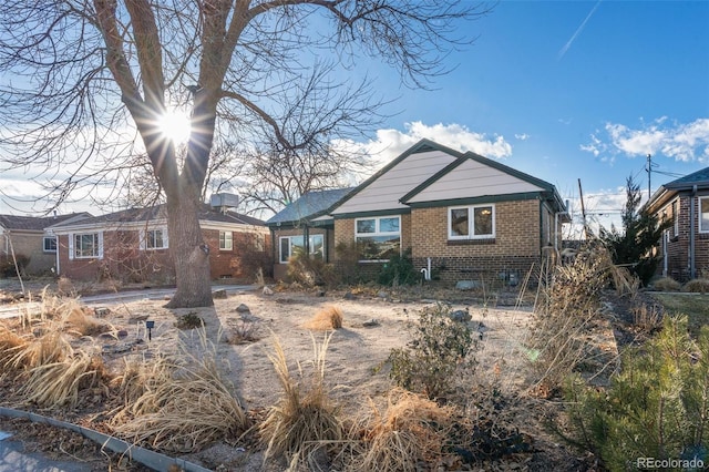 view of front of house featuring brick siding