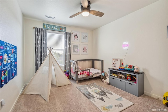 bedroom with baseboards, visible vents, ceiling fan, and carpet flooring