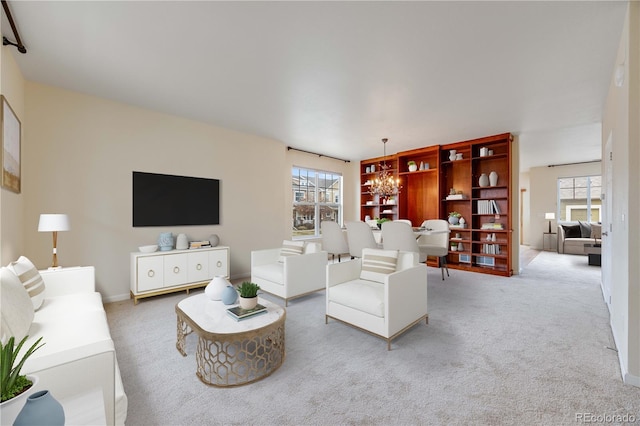 22813 E Briarwood Pl, Aurora, CO 80016 - carpeted living room featuring a chandelier