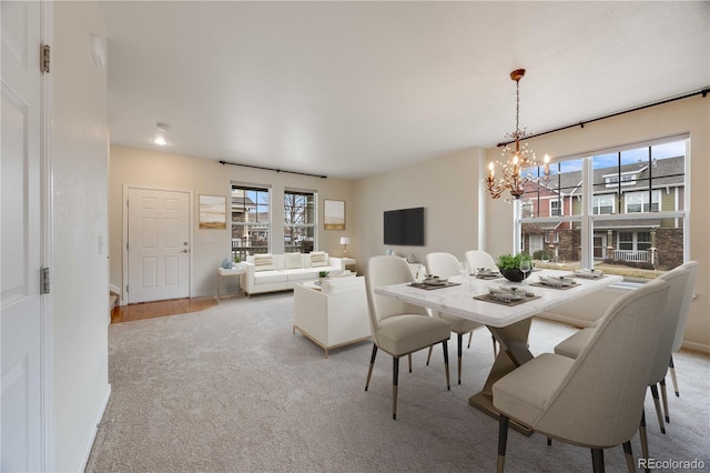 22813 E Briarwood Pl, Aurora, CO 80016 - dining room with a chandelier and light colored carpet