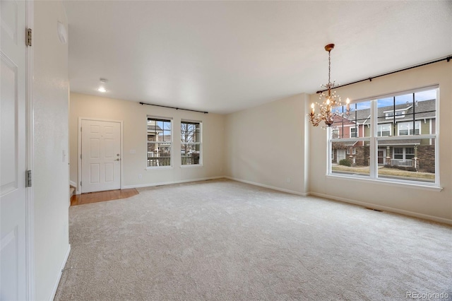 22813 E Briarwood Pl, Aurora, CO 80016 - carpeted empty room featuring a chandelier and baseboards