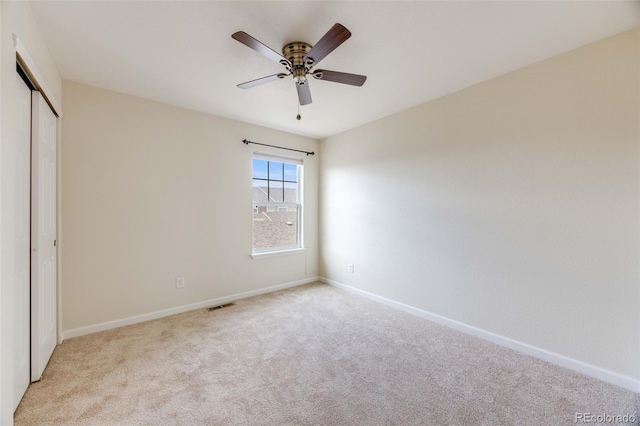 22813 E Briarwood Pl, Aurora, CO 80016 - unfurnished bedroom with light colored carpet, a closet, and a ceiling fan