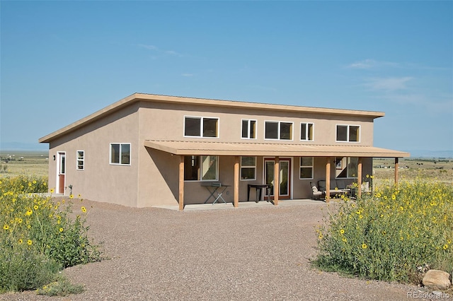 back of house featuring a patio