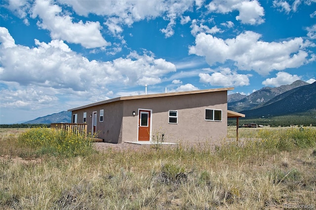 rear view of house with a mountain view