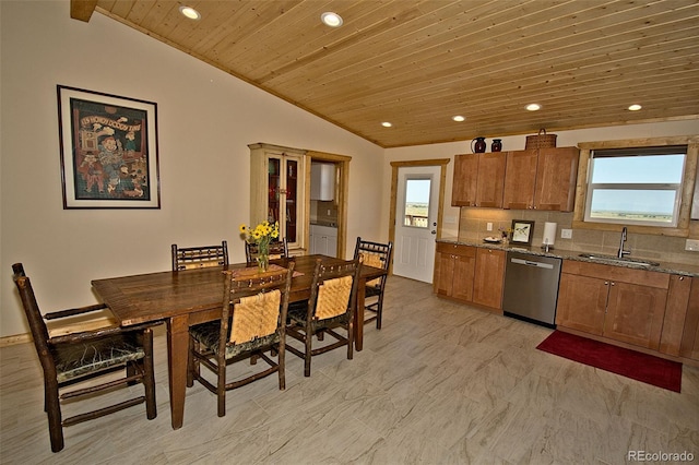 kitchen featuring tasteful backsplash, dishwasher, light stone counters, wood ceiling, and sink