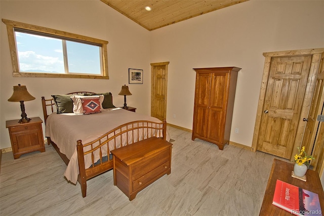 bedroom with high vaulted ceiling and wooden ceiling