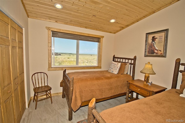 bedroom with a closet and wood ceiling