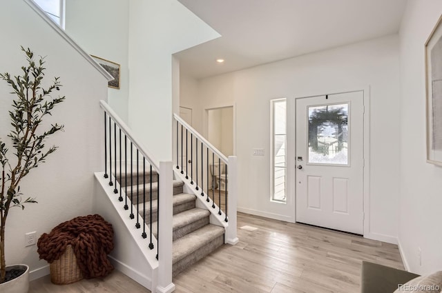 foyer with light hardwood / wood-style floors