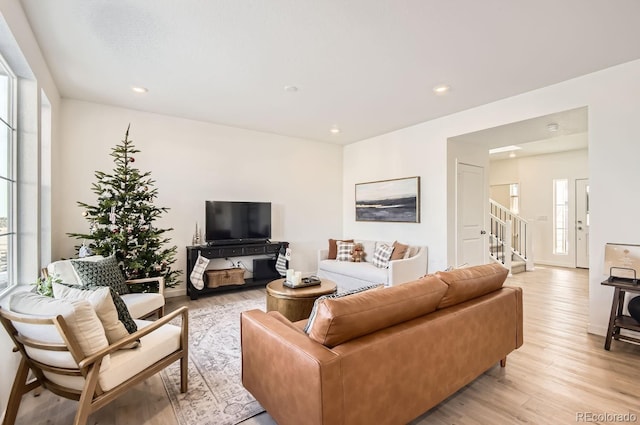 living room featuring plenty of natural light and light hardwood / wood-style floors