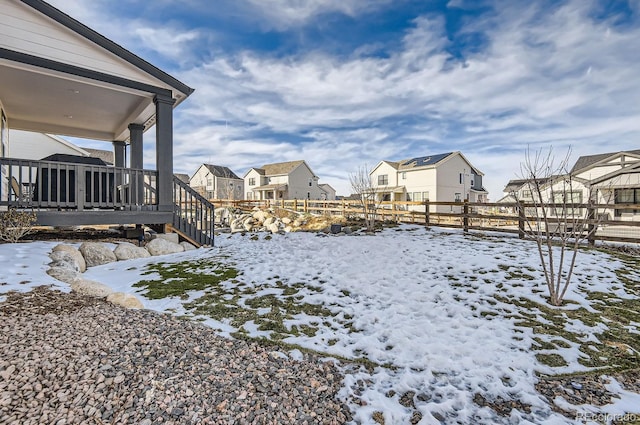 view of yard covered in snow