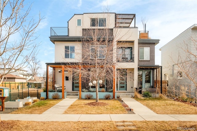 view of front of property with a balcony