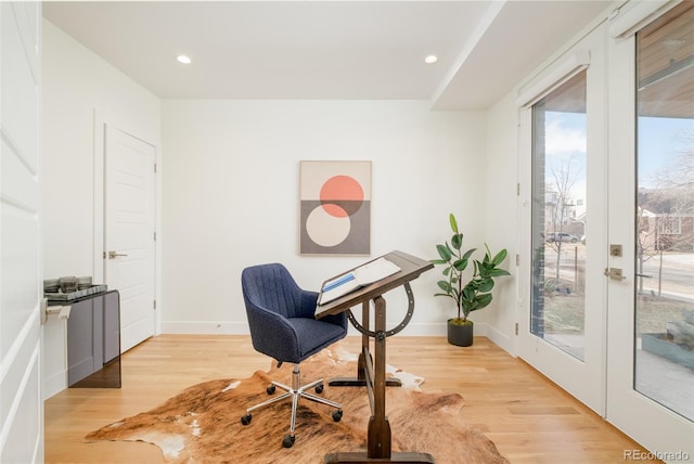 office featuring light wood-type flooring and french doors