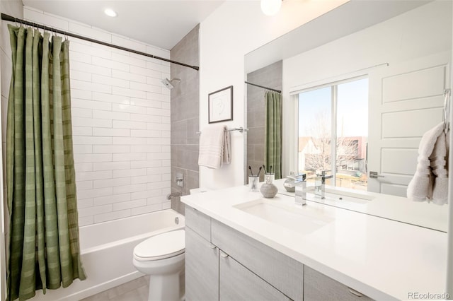 full bathroom with vanity, toilet, and shower / tub combo