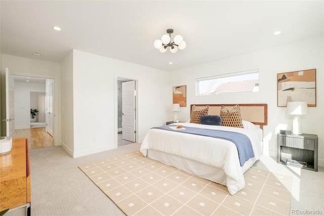 bedroom featuring carpet and a notable chandelier