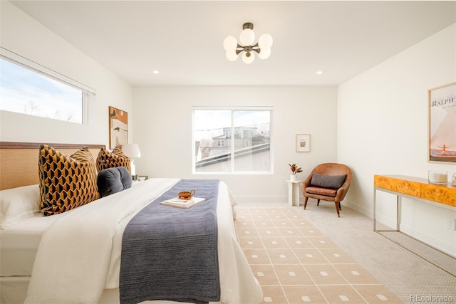 bedroom with a notable chandelier and carpet