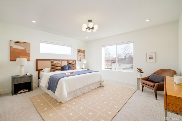 bedroom with carpet and an inviting chandelier