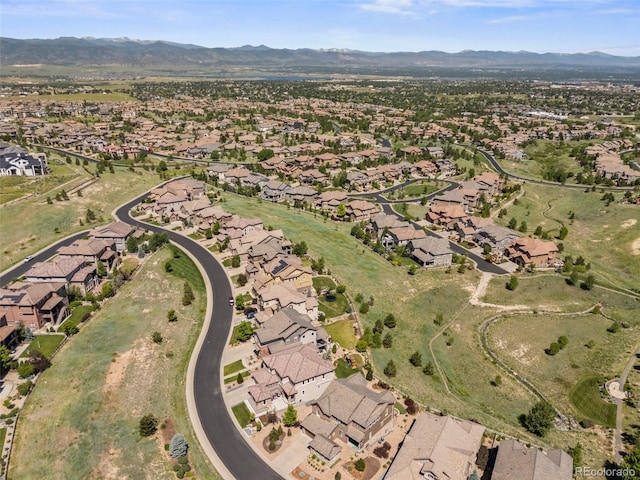 10757 Timberdash Ave, Highlands Ranch, CO 80126 - aerial overview of property's location with nearby suburban area and a mountain backdrop