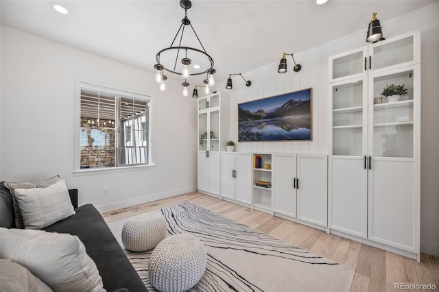 10757 Timberdash Ave, Highlands Ranch, CO 80126 - living area featuring light wood-type flooring, recessed lighting, and built in shelves