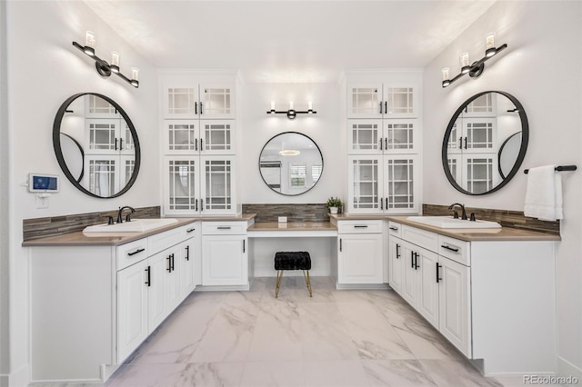 10757 Timberdash Ave, Highlands Ranch, CO 80126 - full bath featuring marble finish floors and two vanities
