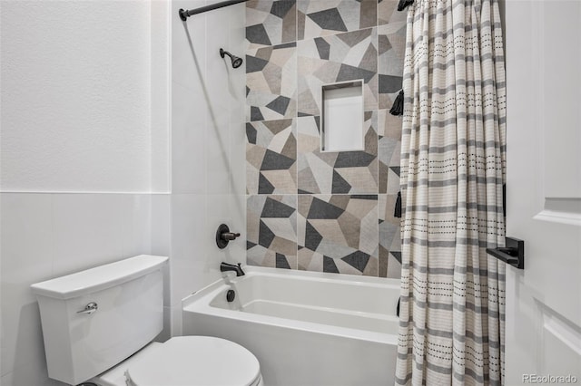 10757 Timberdash Ave, Highlands Ranch, CO 80126 - full bath with shower / bath combo, tile walls, and a wainscoted wall