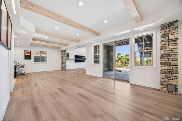 10757 Timberdash Ave, Highlands Ranch, CO 80126 - unfurnished living room featuring beamed ceiling, recessed lighting, and light wood finished floors
