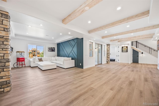 10757 Timberdash Ave, Highlands Ranch, CO 80126 - living area with stairway, light wood-type flooring, recessed lighting, beam ceiling, and an accent wall