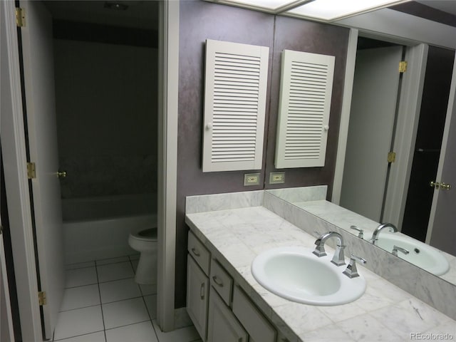 1900 E Girard Pl Unit 203, Englewood, CO 80113 - bathroom with tile patterned floors, vanity, and a bath
