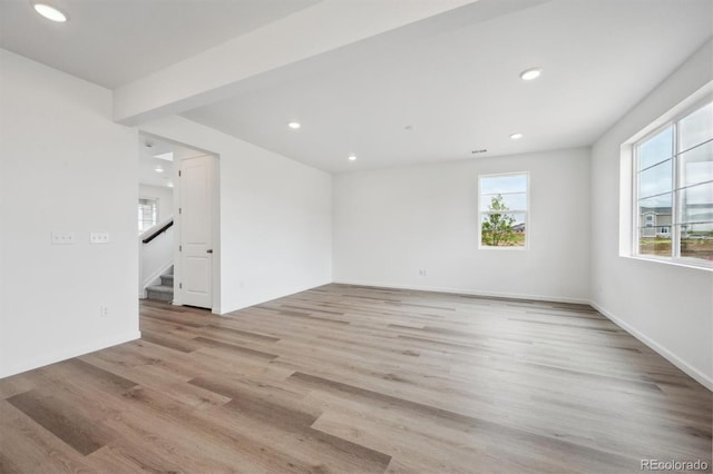 24790 E 39th Ave, Aurora, CO 80019 - unfurnished room with plenty of natural light, recessed lighting, light wood-style floors, and stairway