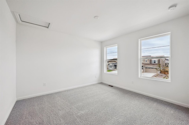 24790 E 39th Ave, Aurora, CO 80019 - carpeted empty room featuring a smoke detector, baseboards, and attic access