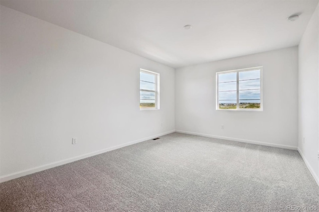 24790 E 39th Ave, Aurora, CO 80019 - carpeted spare room featuring baseboards and a smoke detector
