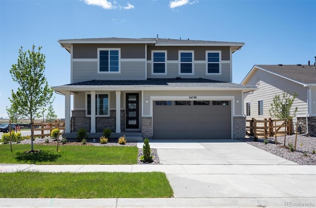 24790 E 39th Ave, Aurora, CO 80019 - view of front of home featuring driveway, brick siding, an attached garage, and covered porch