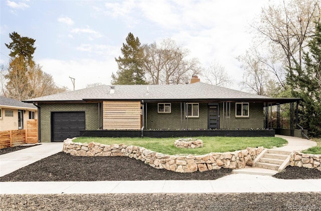 1330 Olive St, Denver, CO 80220 - ranch-style house featuring a garage, driveway, brick siding, a chimney, and a porch