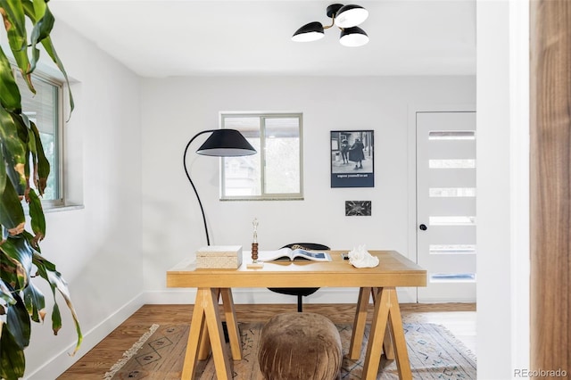 1330 Olive St, Denver, CO 80220 - home office with a chandelier, light wood-style floors, and baseboards