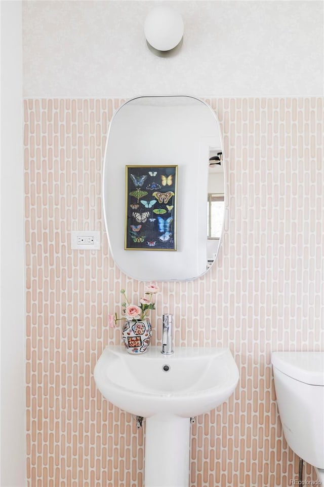 1330 Olive St, Denver, CO 80220 - bathroom with tile walls and toilet