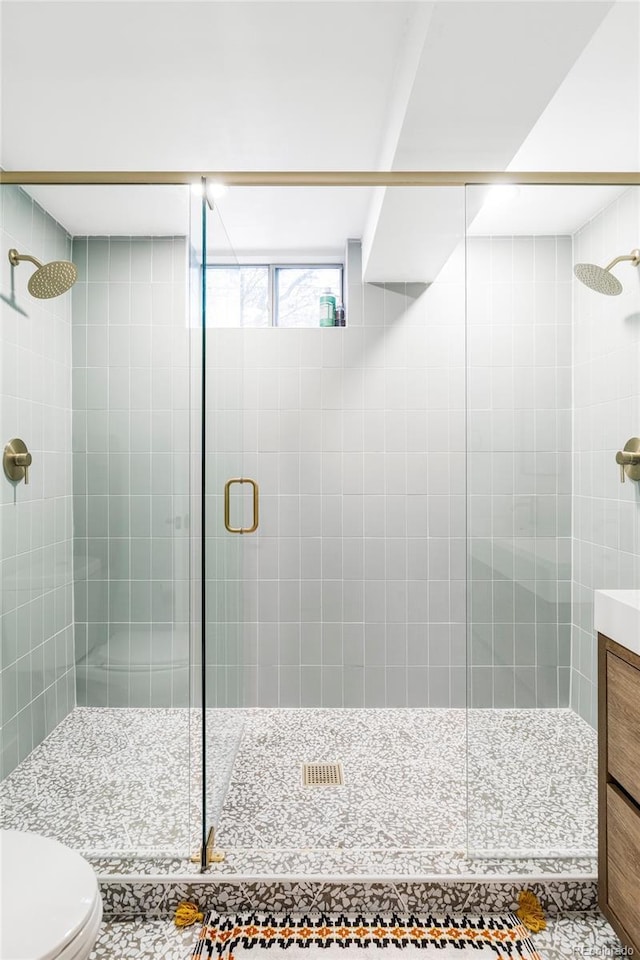 1330 Olive St, Denver, CO 80220 - bathroom featuring a stall shower, toilet, and vanity