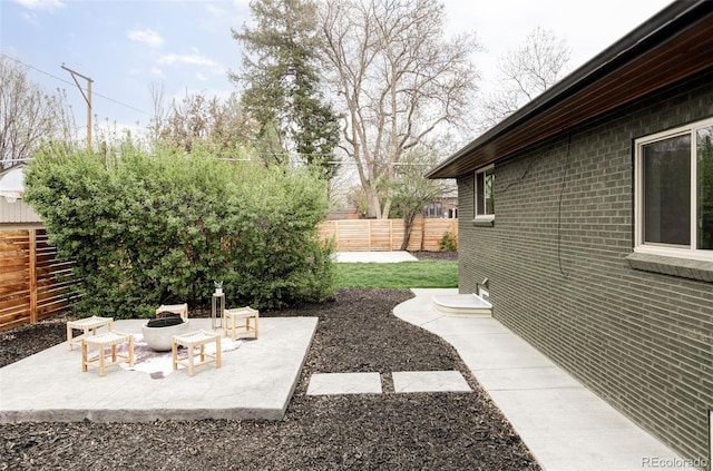 1330 Olive St, Denver, CO 80220 - fenced backyard with an outdoor fire pit and a patio