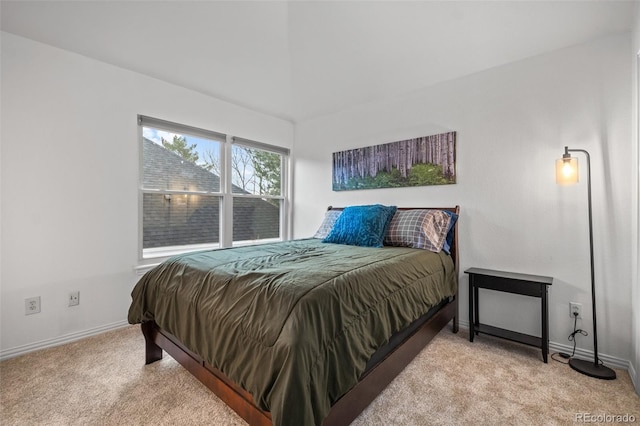 carpeted bedroom with baseboards