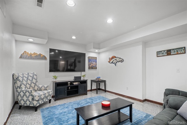 living room with baseboards, recessed lighting, visible vents, and speckled floor