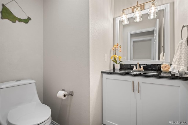 half bath with vanity and toilet