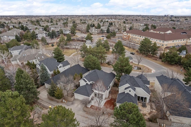 birds eye view of property with a residential view