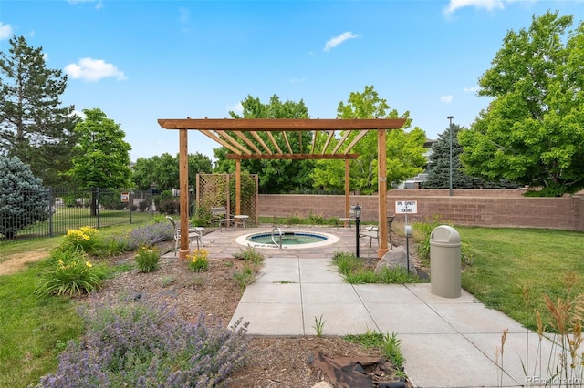 view of yard featuring a hot tub, fence, and a patio area