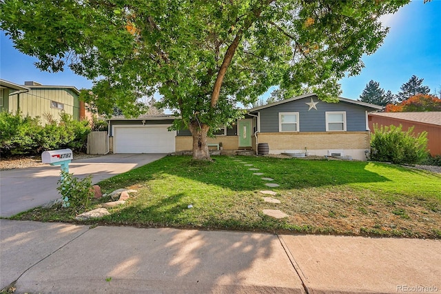 view of front of property featuring brick siding, concrete driveway, entry steps, a garage, and a front lawn