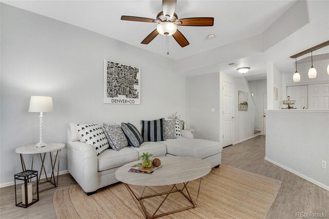 9080 Gale Blvd Unit 4, Thornton, CO 80260 - living area featuring wood finished floors, baseboards, and a ceiling fan
