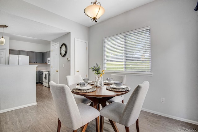 9080 Gale Blvd Unit 4, Thornton, CO 80260 - dining area featuring light wood-style floors and baseboards