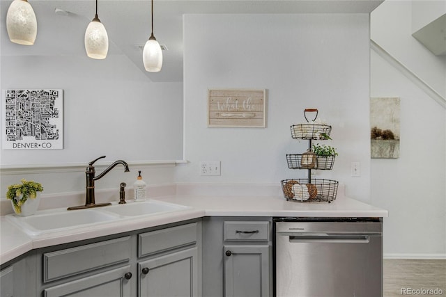 9080 Gale Blvd Unit 4, Thornton, CO 80260 - kitchen featuring stainless steel dishwasher, a sink, gray cabinetry, light countertops, and decorative light fixtures